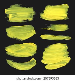 Realistic strokes set drawn thick yellow paint on black background 2