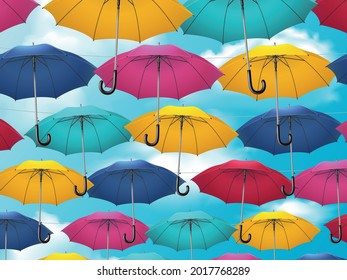 Realistic umbrella composition colorful umbrella canes connected together hanging against the sky vector illustration