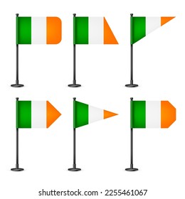 Realistic various Irish table flags on a black steel pole. Souvenir from Ireland. Desk flag made of paper or fabric, shiny metal stand. Mockup for promotion and advertising. Vector illustration