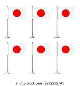 Realistic various Japanese table flags on a chrome steel pole. Souvenir from Japan. Desk flag made of paper or fabric, shiny metal stand. Mockup for promotion and advertising. Vector illustration