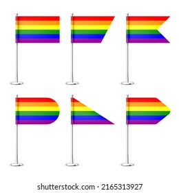 Realistic various table flags on a chrome steel pole. Rainbow LGBT desk flag made of paper or fabric. Shiny metal stand. Mockup for promotion and advertising. Vector illustration