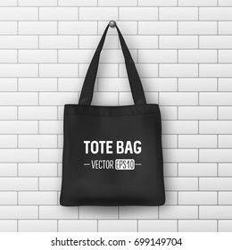 Realistic vector black textile tote bag. Closeup on brick wall background. Design template for branding, mockup. EPS10.