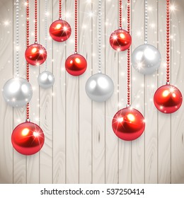  Realistic vector Christmas baulbles hanging on wooden table,