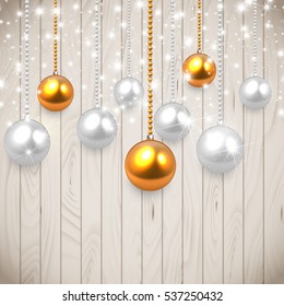  Realistic vector Christmas baulbles hanging on wooden table,