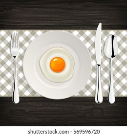 Realistic vector fried egg icon on a plate with fork and knife. Design template.