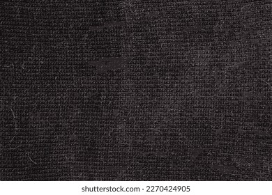 Realistic vector illustration of black textured wool knitted fabric. Close-up, fabric, knitwear.
