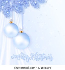 realistic vector illustration of christmas greeting card with pair of white frozen christmas balls are hanging on a branch of christmas tree with silk fabric on a background.