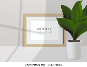 Realistic vector mockup with photo frame and plant leaves. Shadow on the wall and empty place for your design. 3d soft light and overlay shadow from plant and window. Realistic illustration mock up.