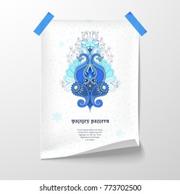 Realistic vector poster mockup. A folded sheet is taped to the wall with adhesive tape. The oriental floral ornament consists of paisley, bluebird feathers and curls. Winter colors and snowflakes