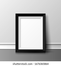 Realistic vertical picture frame on the floor near the wall.