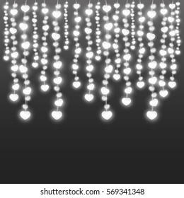 Realistic vertically hanging garlands with lights in shape of heart on black background. Vector illustration.