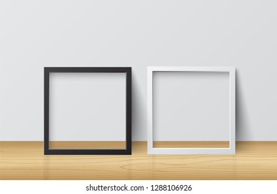 Realistic White and Black Blank Picture Square Frame, standing on Light Wood Floor at White Wall from the Front. 
Design Template for Mock Up.
Vector illustration