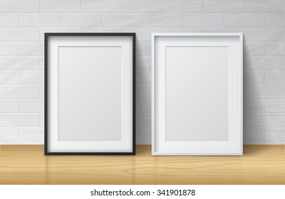 Realistic White and Black Blank Picture frame, standing on Light Wood Floor at
White Brick Wall from the Front. Vector illustration
Design Template for Mock Up.