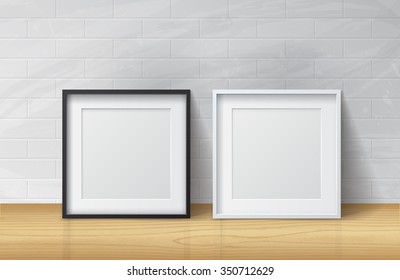 Realistic White and Black Blank Picture Square frame, standing on Light Wood Floor at
White Brick Wall from the Front. 
Design Template for Mock Up. Vector illustration