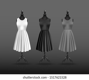 Realistic white, black and grey dress collection on headless mannequin display stand. Fashion clothing items displayed on dummy figure rack - vector illustration.