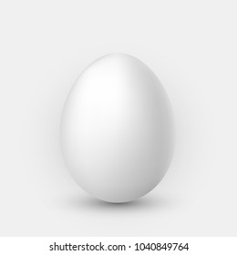 Realistic white egg with shadow on white background