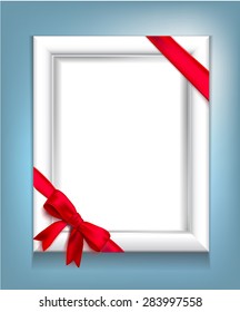 Realistic white frame with a red ribbon tied on the corners with a red bow on a blue background. Vector illustration