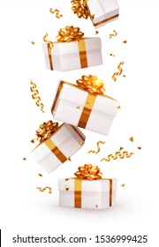 Realistic white gift boxes. Falling shiny golden confetti isolated on white background. Bright festive tinsel of gold color. Xmas present