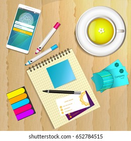 Realistic work desk organization with open diary and stickers for notes on the wooden textured table. Top view with cup of tea, smartphone and pencil to write note and remarks.