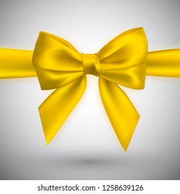 Realistic yellow bow. Element for decoration gifts, greetings, holidays. Vector illustration.