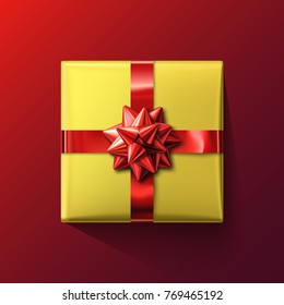 Realistic yellow gift box with shiny bow isolated on red background. Vector illustration for gift vouchers, special offers, big sale, and holiday design Christmas, New Year, Birthday, Valentine’s Day.