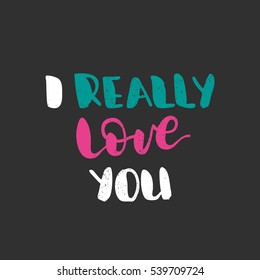 I really love you. Bright multi-colored romantic letters on dark background. Modern, stylish hand drawn lettering. Quote. Hand-painted inscription. Calligraphy poster, typography. Valentine's Day.