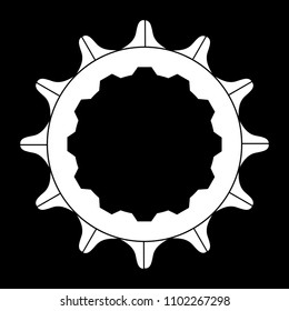 The rear driven cog of a bicycle over a black background