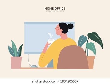 Rear view of Asian woman sitting at desk and having a cup of coffee at home office. Concept of freelance or work from home.