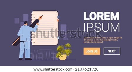 rear view businessman writing in notebook businessman planning on note control list on notepad survey quiz to-do list agreement