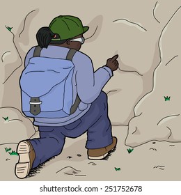 Rear view of female hiker pointing at rock