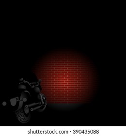 Rear view of motorcycle front light on a red brick wall in the night