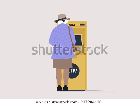A rear view of a senior lady withdrawing money from an outdoor ATM machine