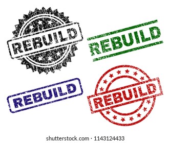 REBUILD seal prints with damaged surface. Black, green,red,blue vector rubber prints of REBUILD tag with corroded surface. Rubber seals with round, rectangle, medal shapes.