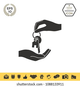 Receiving the key with keychain shaped like a house - icon.