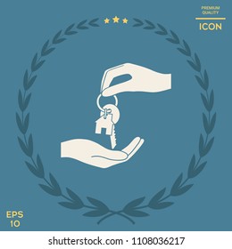 Receiving the key with keychain shaped like a house - icon.