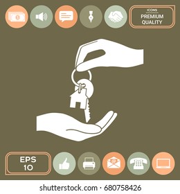 Receiving the key with keychain shaped like a house - icon.