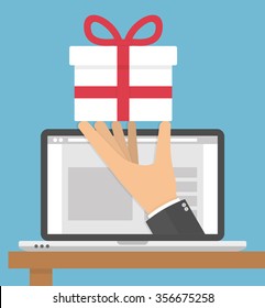 Receiving or ordering gift online concept. Hand holding white gift box with red bow out of a laptop screen. Flat style