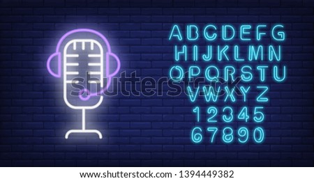 Recording studio neon icon. Mic and headset on brick wall background. Sound equipment concept. Vector illustration can be used for neon signs, billboards, show business