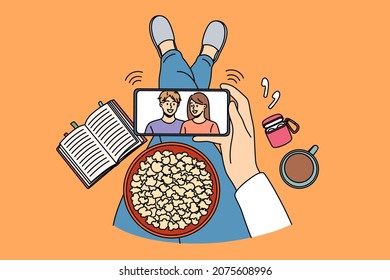 Recreation activity and leisure concept. Top view of human hands holding smartphone with movie on screen popcorn and coffee vector illustration 