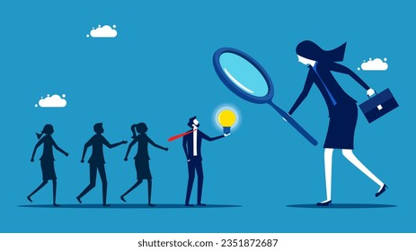 Recruitment with wisdom. Businesswoman using a magnifying glass to select smart job candidates