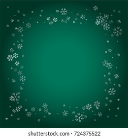 Rectangle Christmas frame or border with random scatter falling silver snowflakes isolated on a dark green gradient background