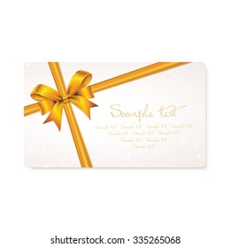 Rectangle paper card with gold ribbon and tied bow.