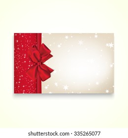 Rectangle paper card with red ribbon and tied bow.
