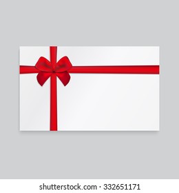 Rectangle paper card with ribbon and tied bow.