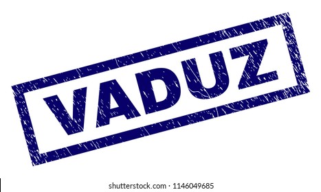 Rectangle VADUZ seal print with corroded texture. Rubber seal imitation has rectangular frame. Blue vector rubber print of VADUZ title with corroded texture.