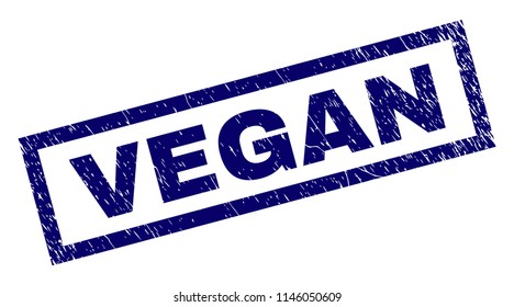 Rectangle VEGAN seal print with corroded texture. Rubber seal imitation has rectangle frame. Blue vector rubber print of VEGAN text with retro texture.