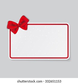 Rectangle white card with tied bow on ribbon.