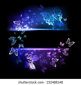Rectangular black banner with glowing colorful butterflies.