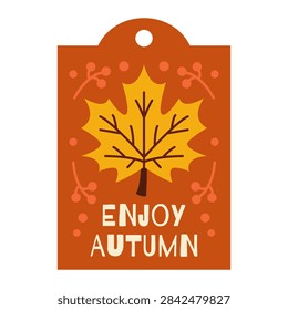 A rectangular orange gift tag featuring a central yellow maple leaf graphic with stylized berry branches and the text Enjoy Autumn in white lettering