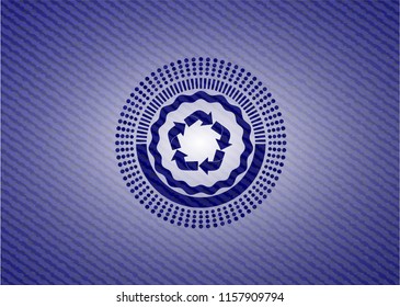 recycle icon inside badge with denim background